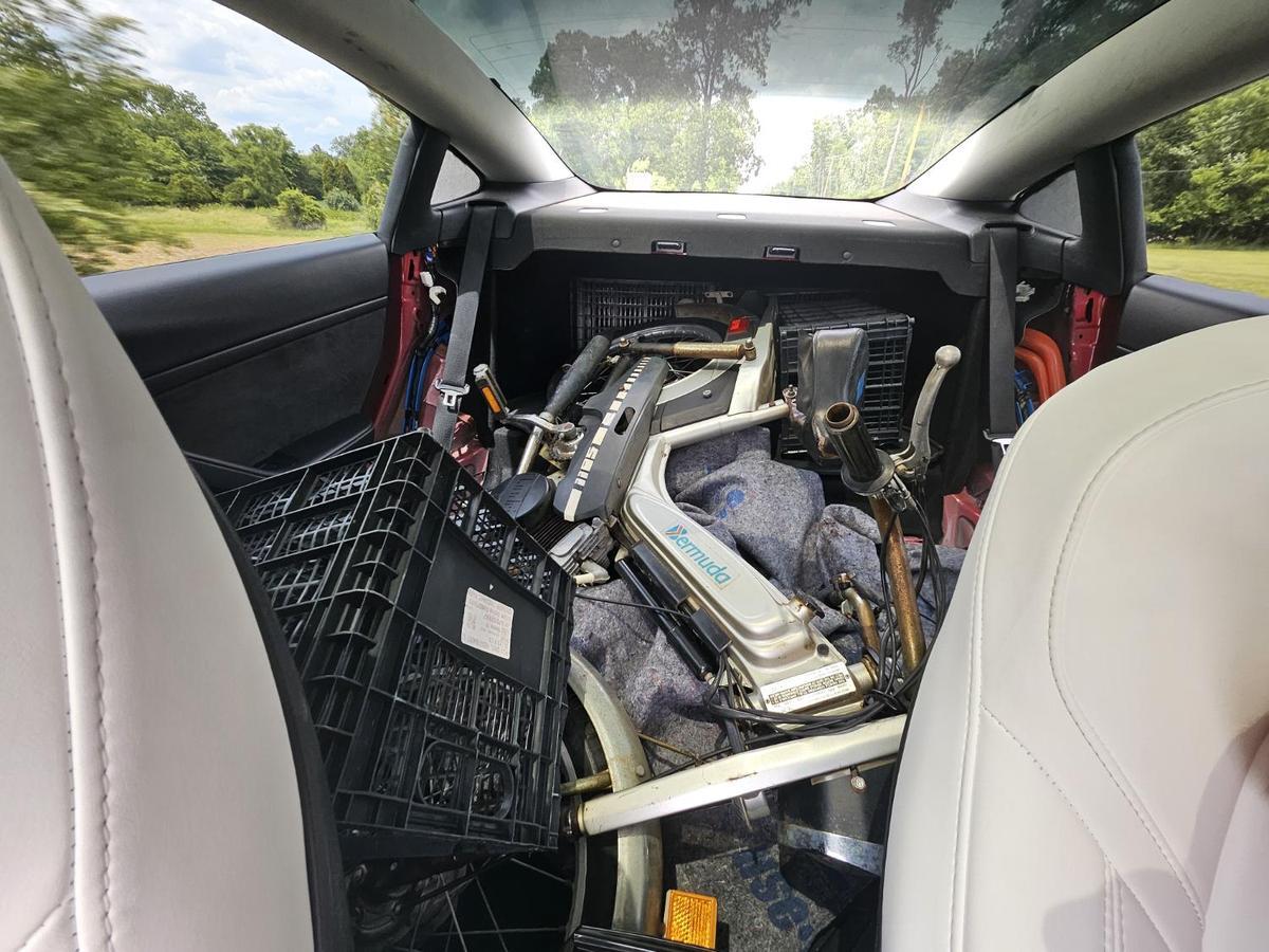 Bermuda moped loaded inside Tesla